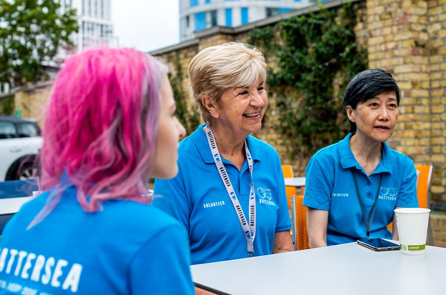 A group of people sitting and laughing