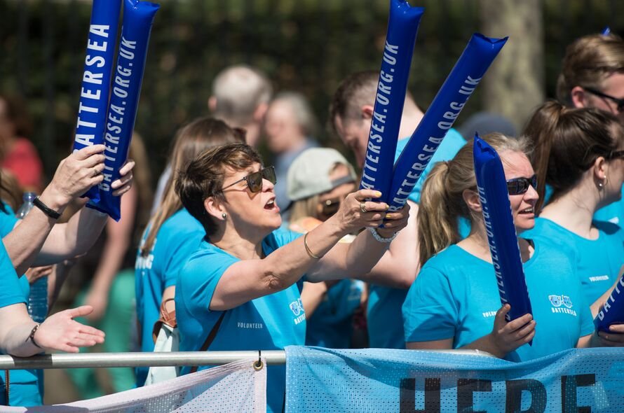 Battersea volunteers cheering at an event