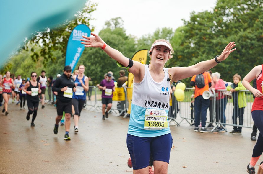  A person with their arms up running