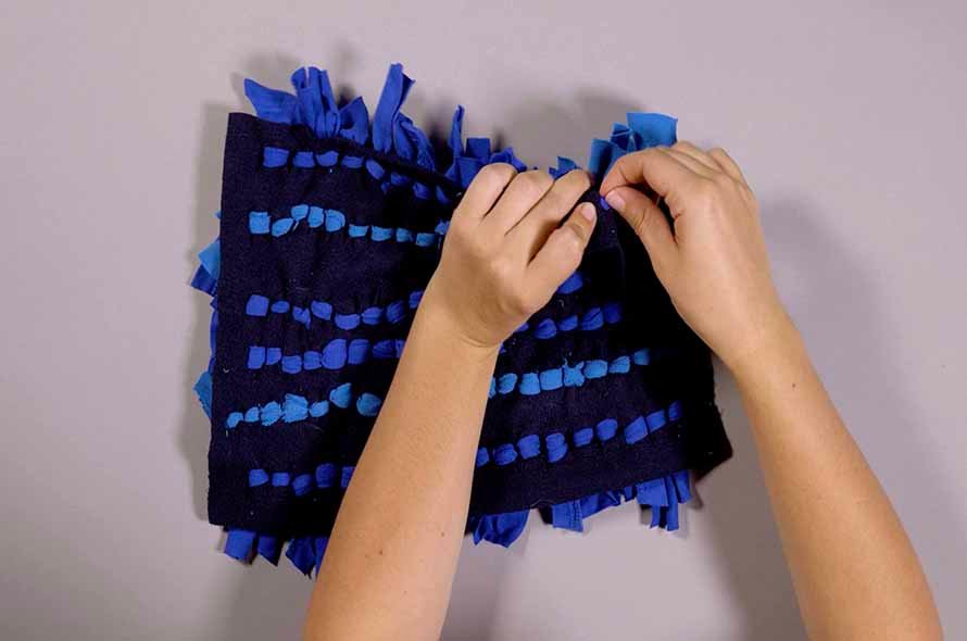 Pieces of a jumper being tied together