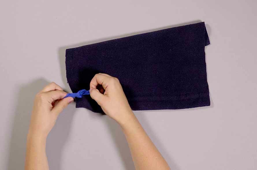 Pieces of a jumper being tied together