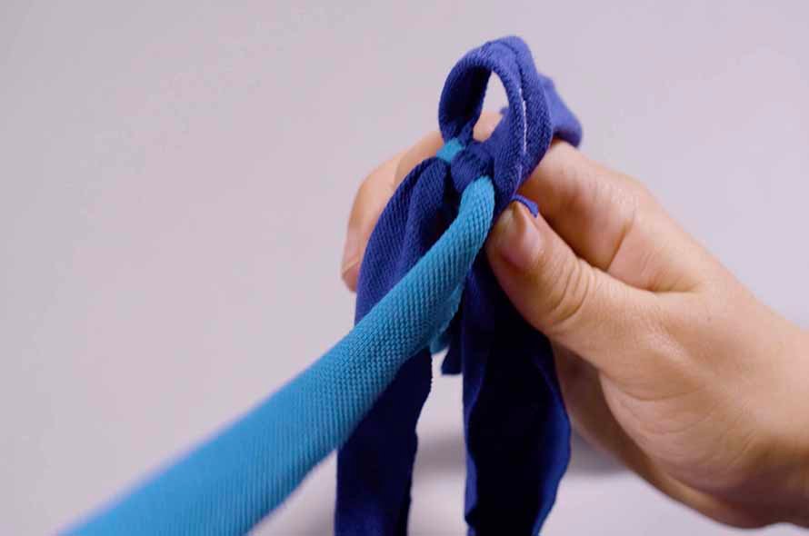 Pieces of fabric being tied together