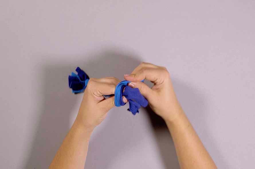 Pieces of fabric being tied together