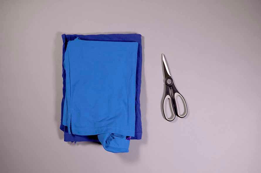 Pile of fabric next to a pair of scissors