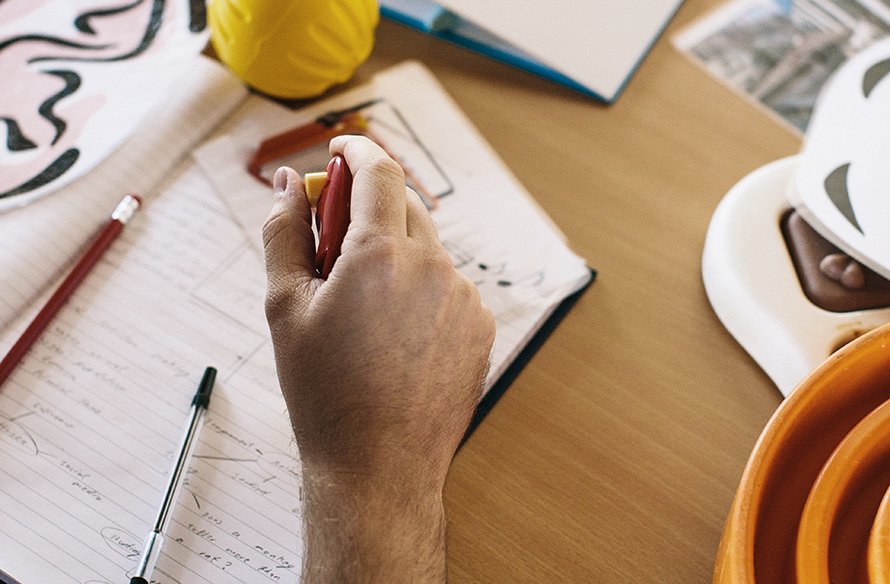 Someone holding a clicker in their hand