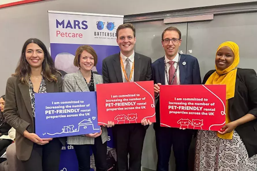 A group of people holding signs