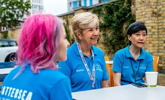 A group of people sitting and laughing