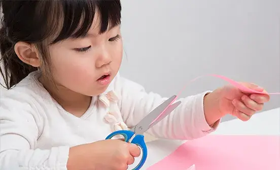 A child cutting paper