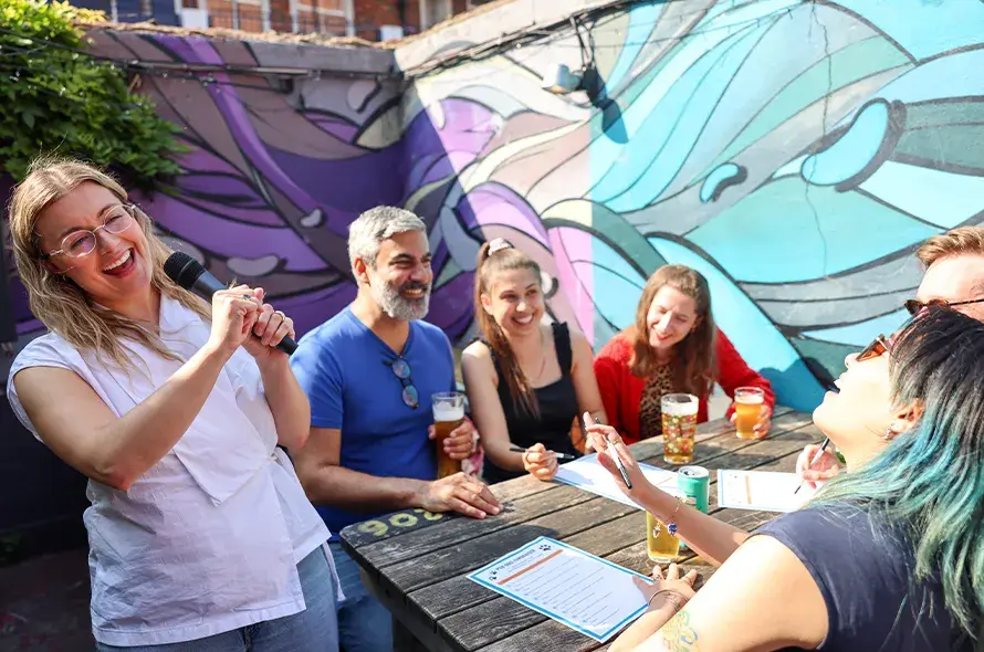 A group of people taking part in a pub quiz