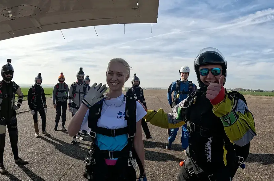People about to sky dive and smiling